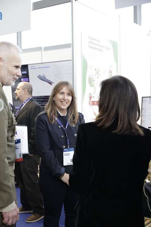 Mayte Tortosa at the Proportione stand explaining the Aviary system at REAIM 2026, A Coruña